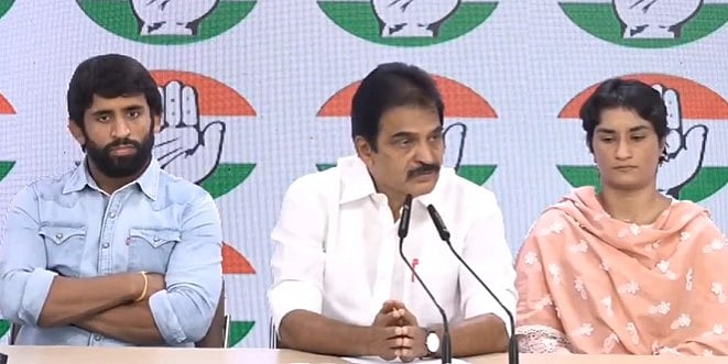X/@INCIndia
 : Wrestlers Bajrang Punia and Vinesh Phogat with Congress leader KC Venugopal